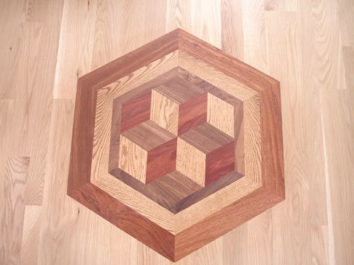 A wooden cutting board in the shape of a hexagon on a wooden floor.