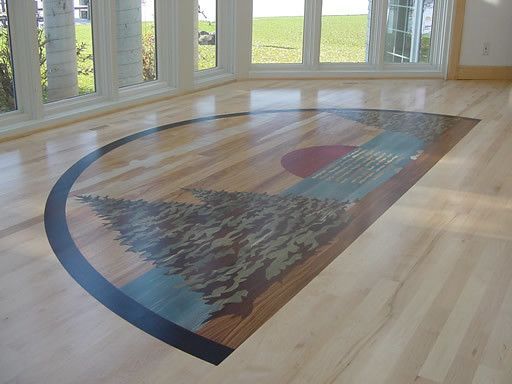 A wooden floor with a picture of a tree on it