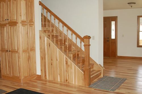 A wooden staircase in a house with hardwood floors