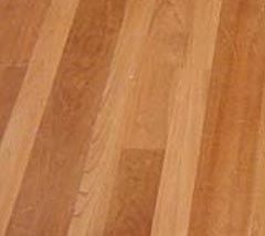 A close up of a wooden floor with a diagonal pattern.