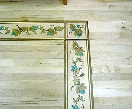 A wooden floor with a floral design on it