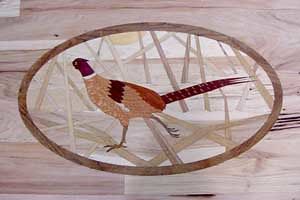 A pheasant is in a wooden frame on a wooden table.