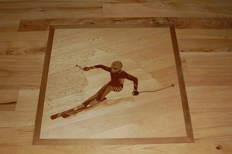 A picture of a person skiing on a wooden floor