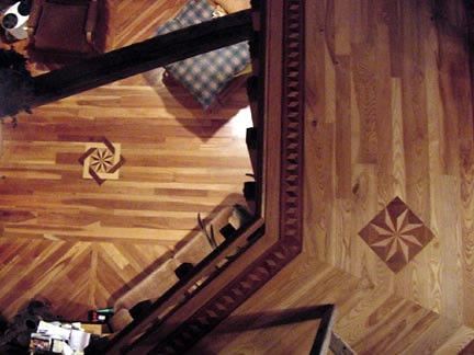 An aerial view of a wooden floor with a star design