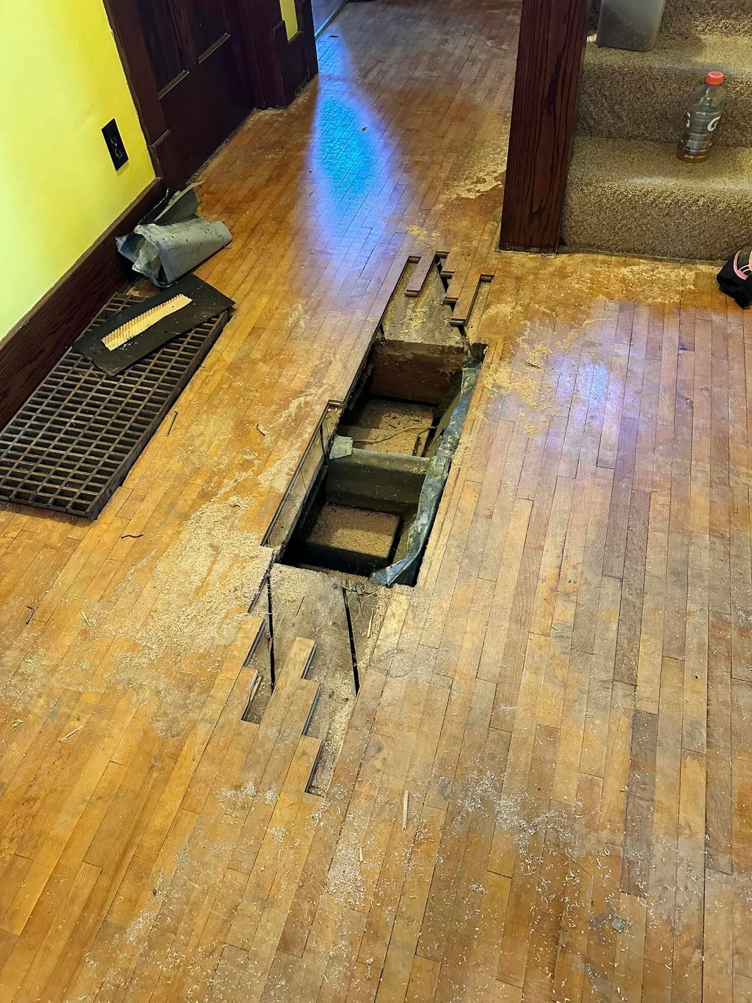There is a hole in the floor in the middle of the room.