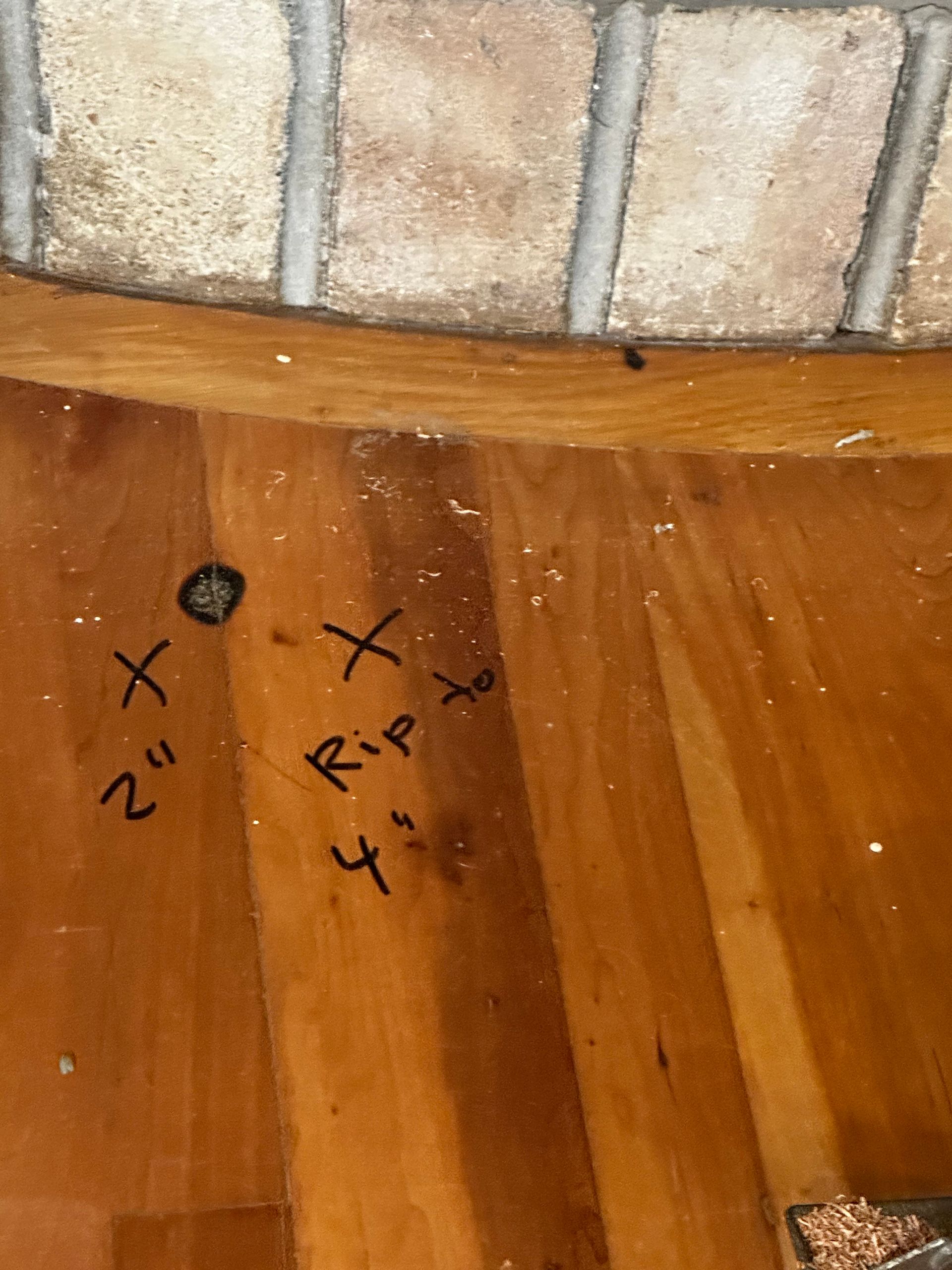 A wooden floor with the words rip written on it