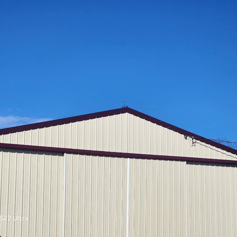 A large building with a blue sky in the background