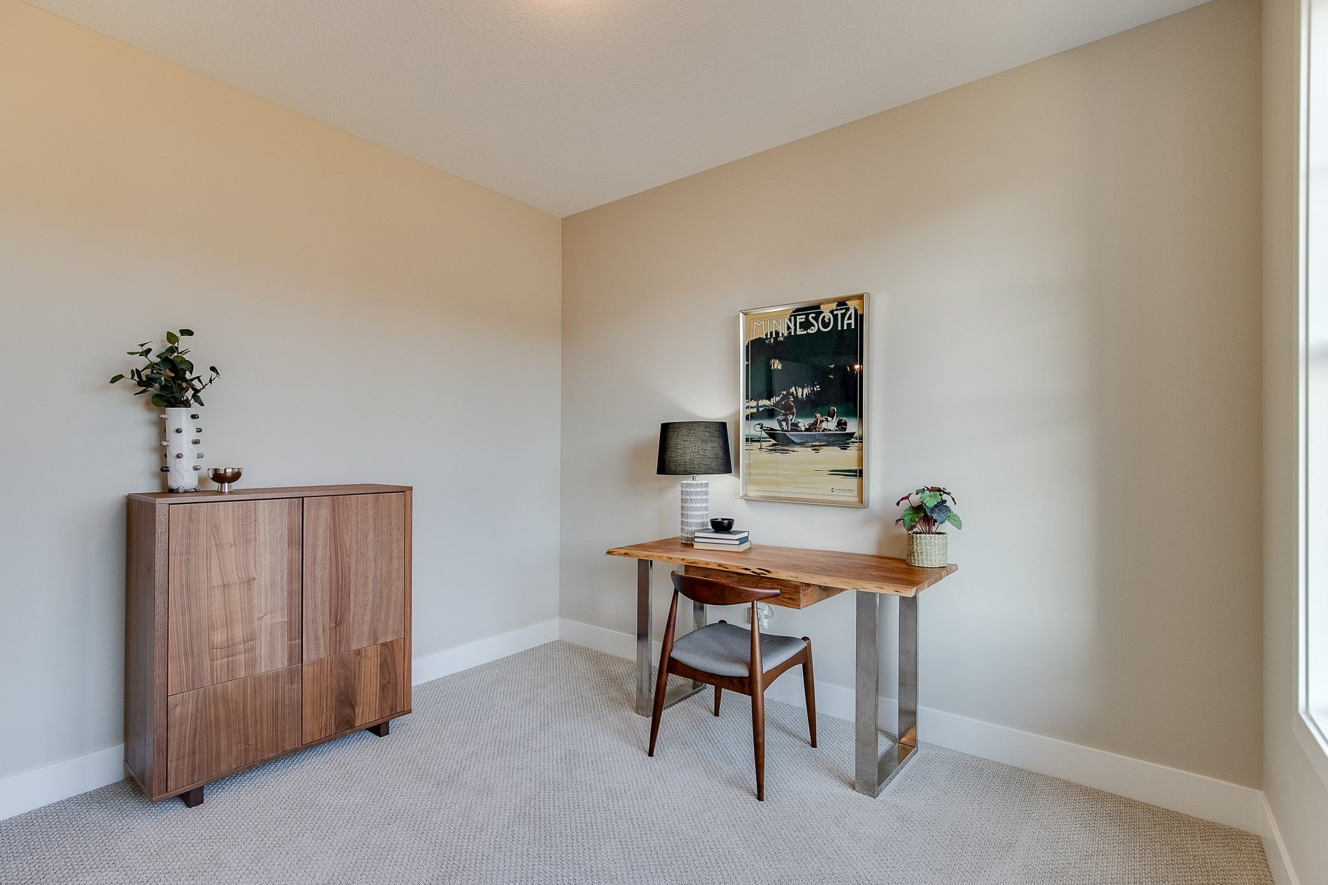 There is a desk and chair in the room.