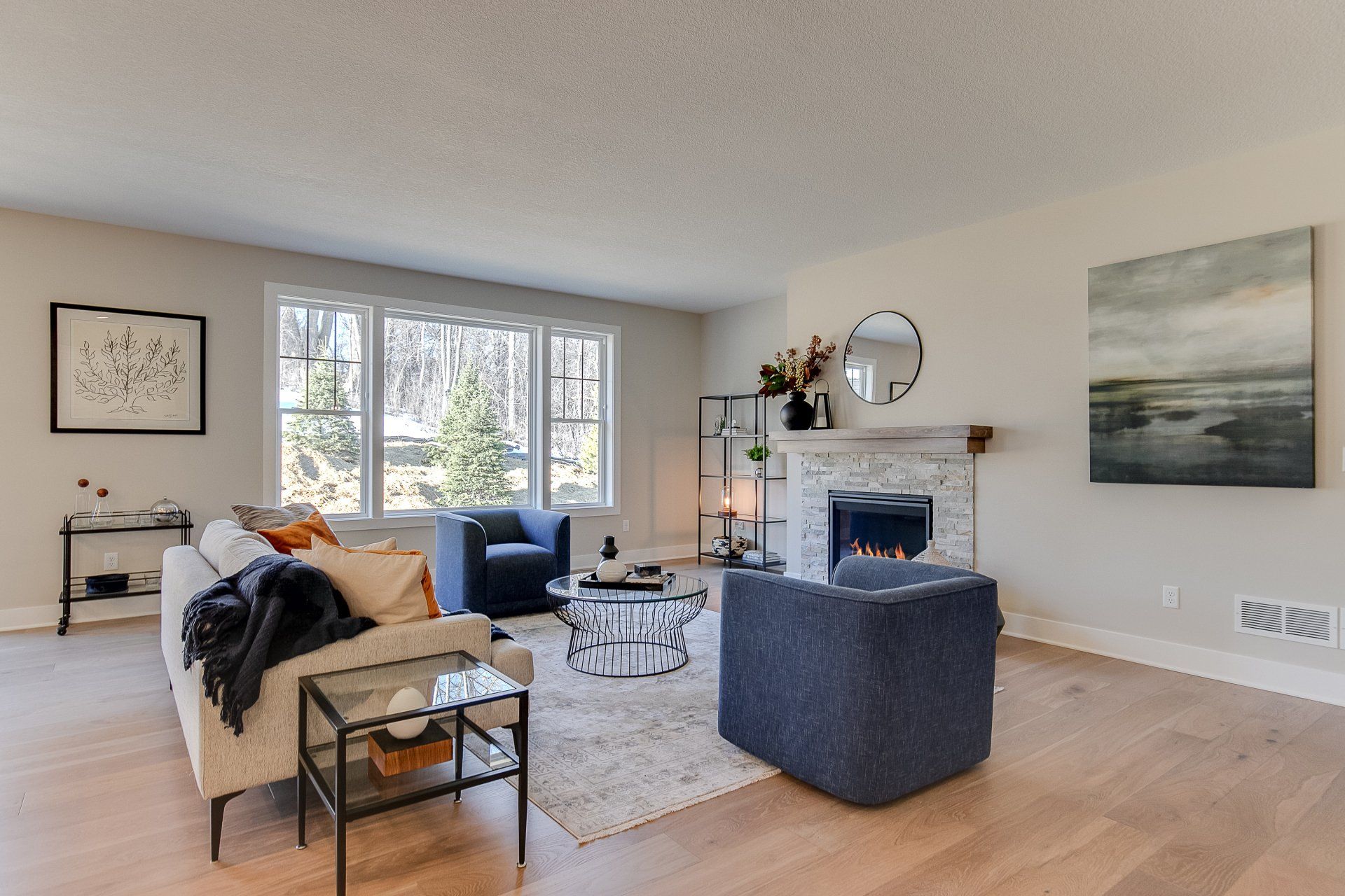 A living room filled with furniture and a fireplace.