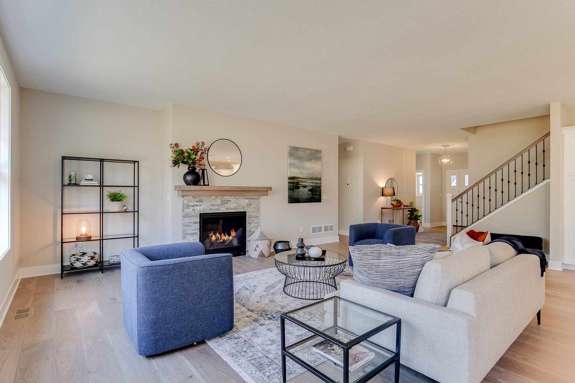 A living room filled with furniture and a fireplace.