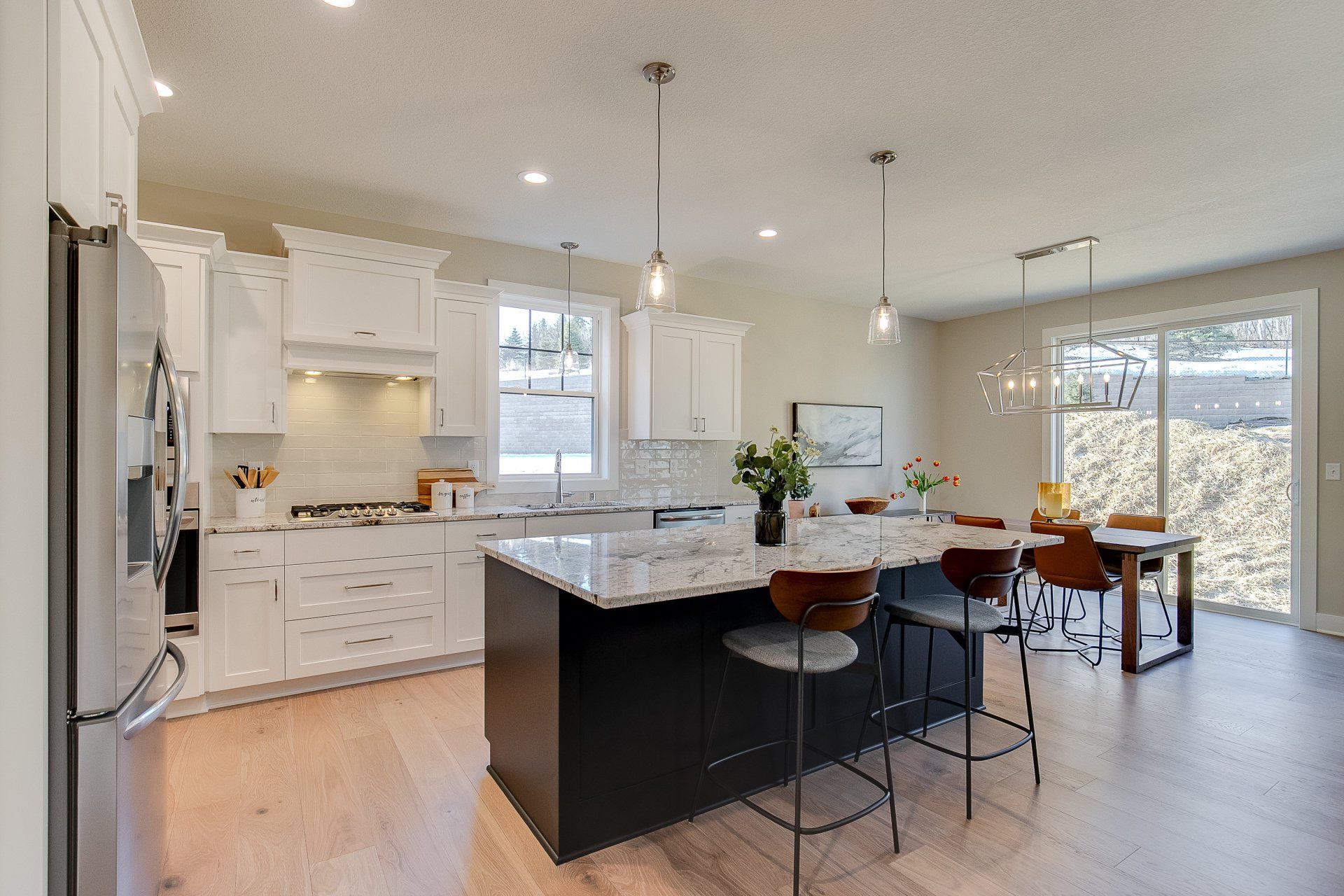 There is a large island in the middle of the kitchen.