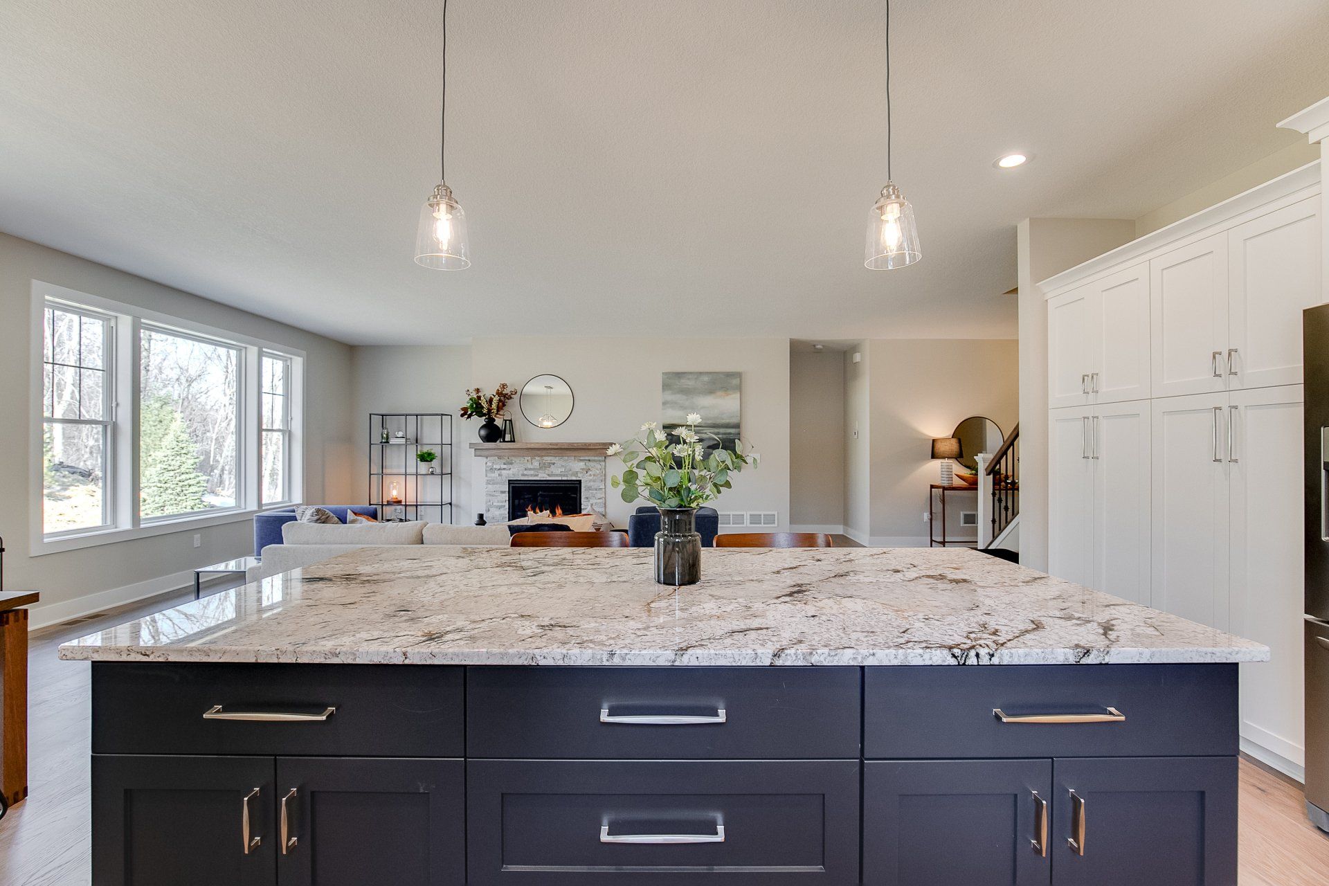 There is a large island in the middle of the kitchen.