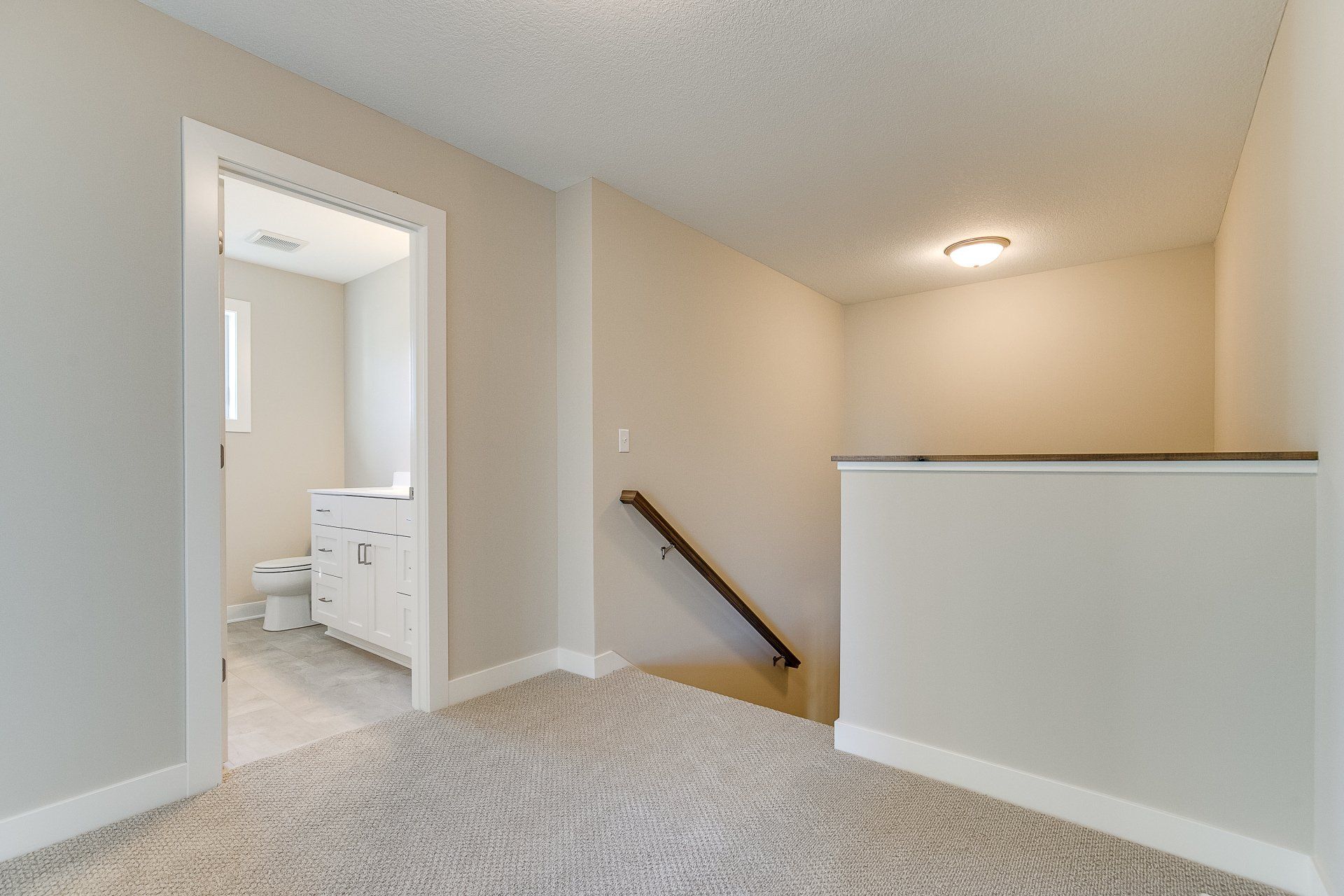 There is a staircase leading up to the second floor of a house.