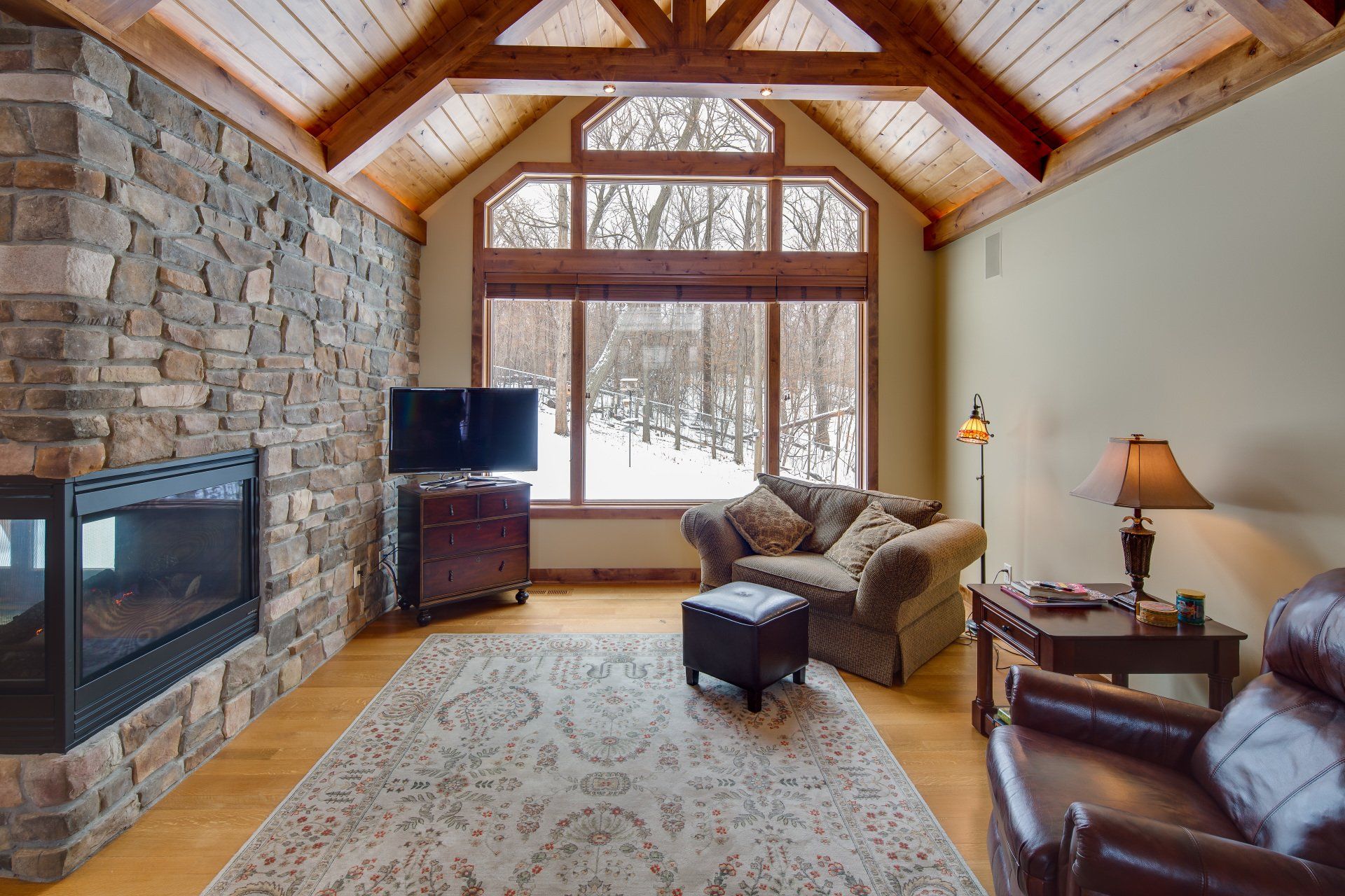 A living room with a fireplace and a couch