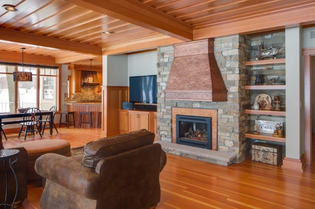 Fireplace area with brown couch