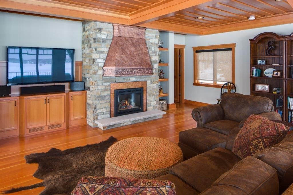 Appealing fireplace area with brown couch