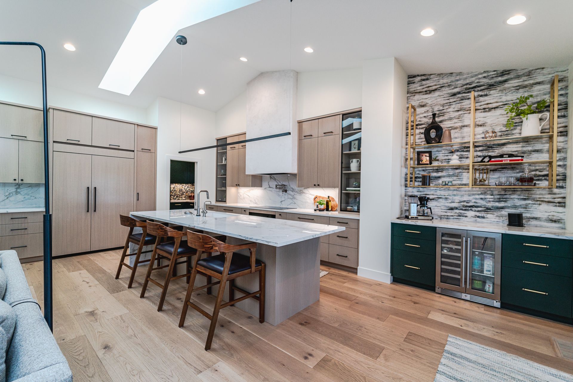 There is a large island in the middle of the kitchen.