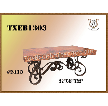 Wrought iron and wood coffee table. Features a distressed brown tabletop with ornate, scrolled legs and a brown-gold background.