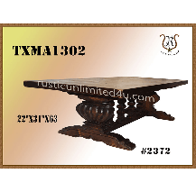 Wooden coffee table with a dark, carved base and a square tabletop. The dimensions are 22x31x63 inches.