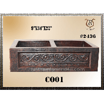 Copper kitchen sink with decorative scrollwork, two basins, and a dark brown finish. The size is 9 x 34 x 22.