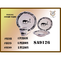 Dinnerware set with a western design: plates, bowls, and mugs with barbed wire rims and cow silhouettes.