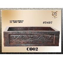 Rectangular copper sink with decorative scrollwork and dark, aged finish. Dimensions are 11 x 33 x 12.