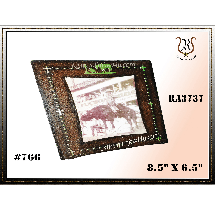 Brown photo frame with a picture of two animals, possibly horses. Green text on top edge and bottom.  Frame dimensions are 8.5 x 6.5.