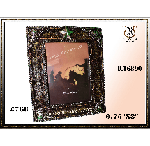 Ornate Western-style picture frame. Displays a cowboy-themed photo, with star and embellishments. Text: 9.75X8.