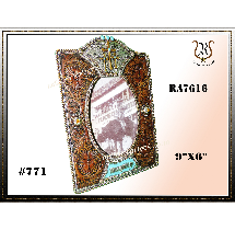 Ornate, brown and teal picture frame with an oval opening. It's 9x6 and has intricate designs.