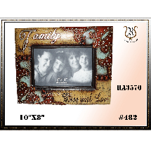 A family photo in a decorated picture frame with the word Family on top. The frame is beige, red, and teal.
