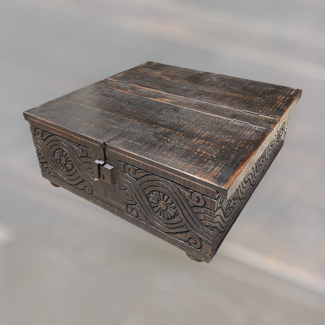 Dark wooden carved box with floral designs and a hinged lid.