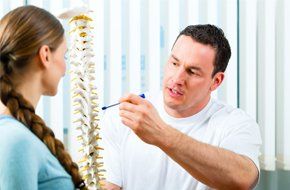 A doctor explaining the form of a spine