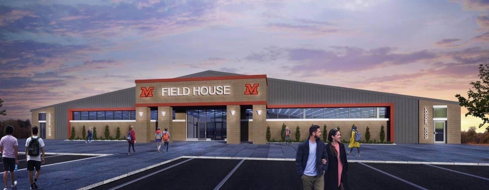 A group of people are walking in front of a building with the word house on it.