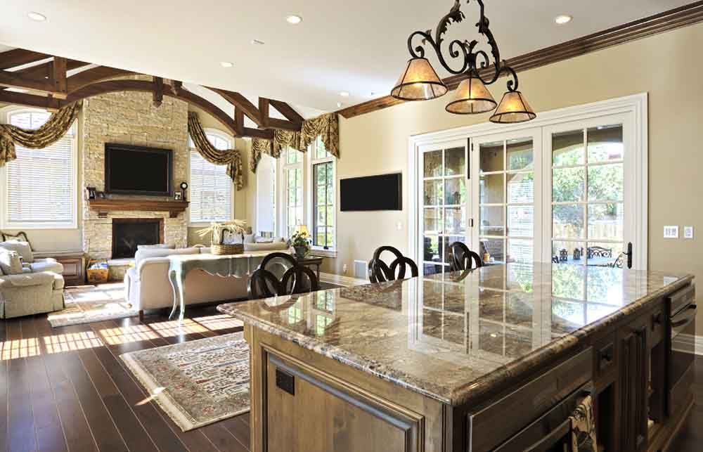 A kitchen with a large island in the middle of the room.