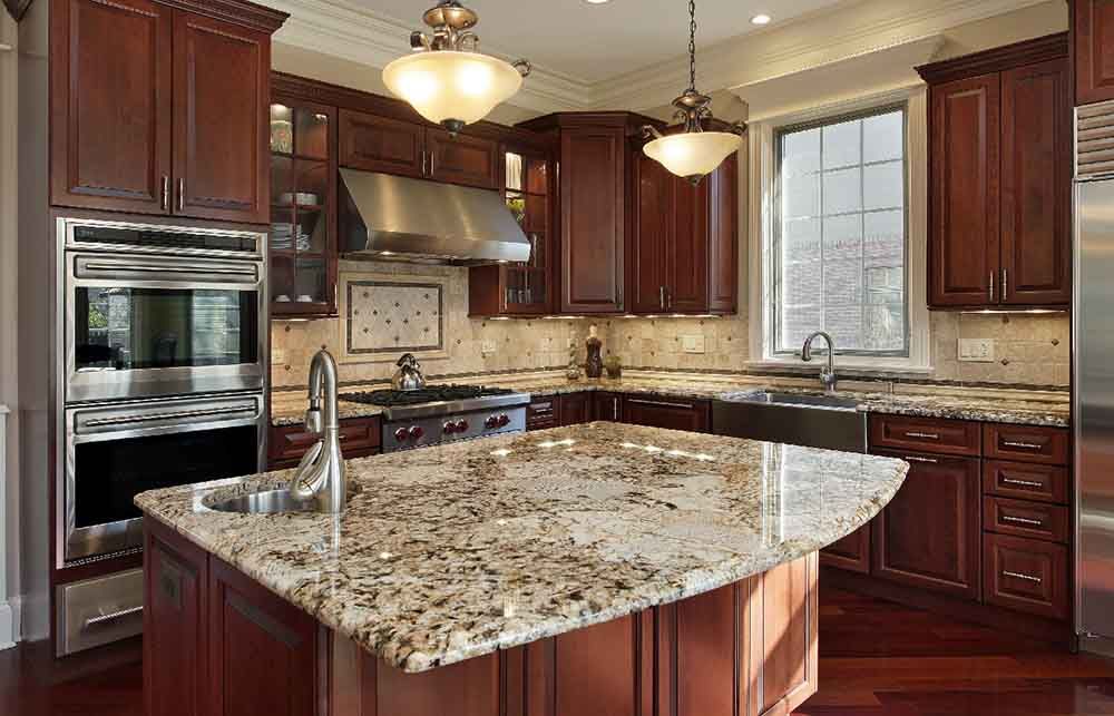 A kitchen with granite counter tops and wooden cabinets