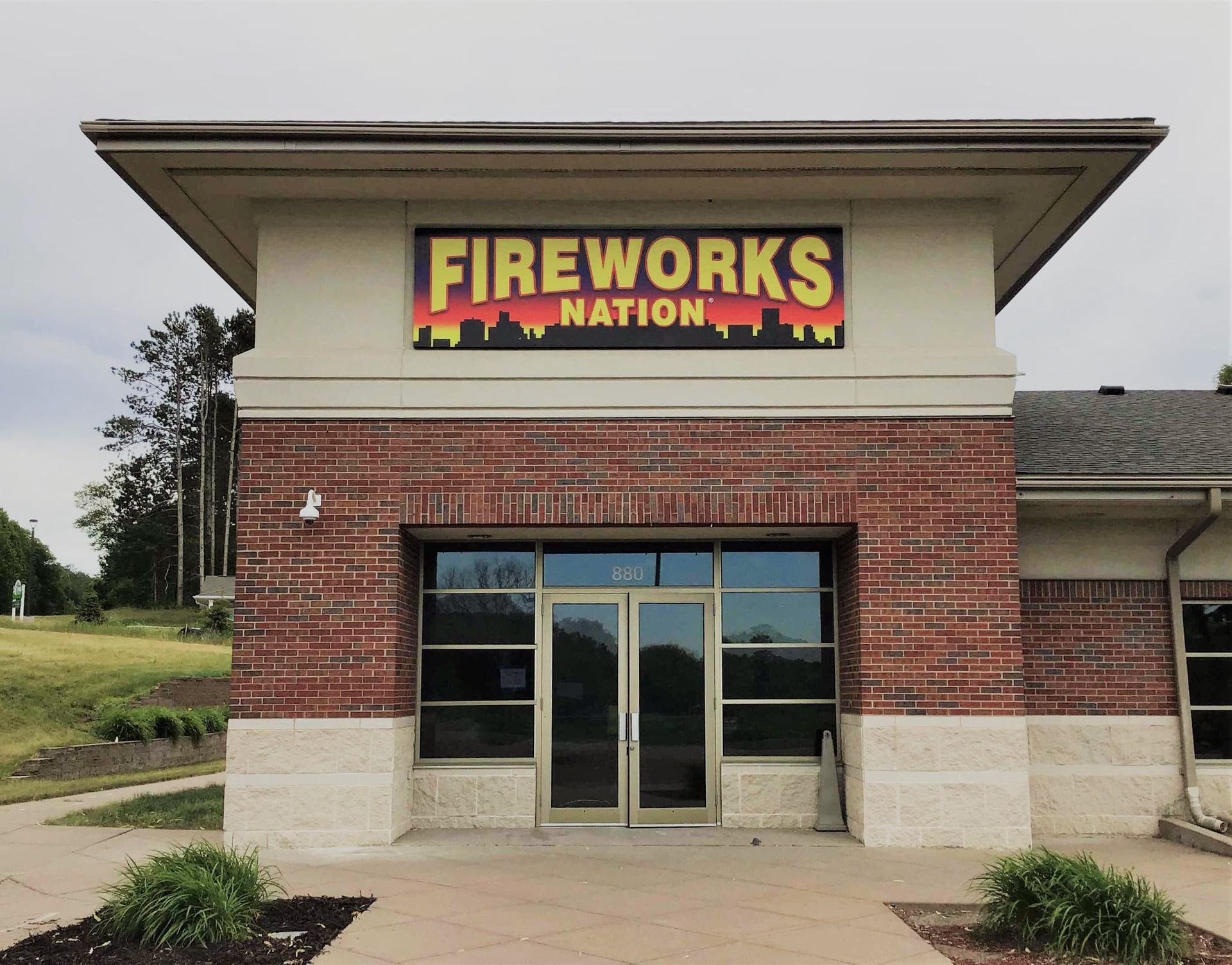 A brick building with a sign that says fireworks nation