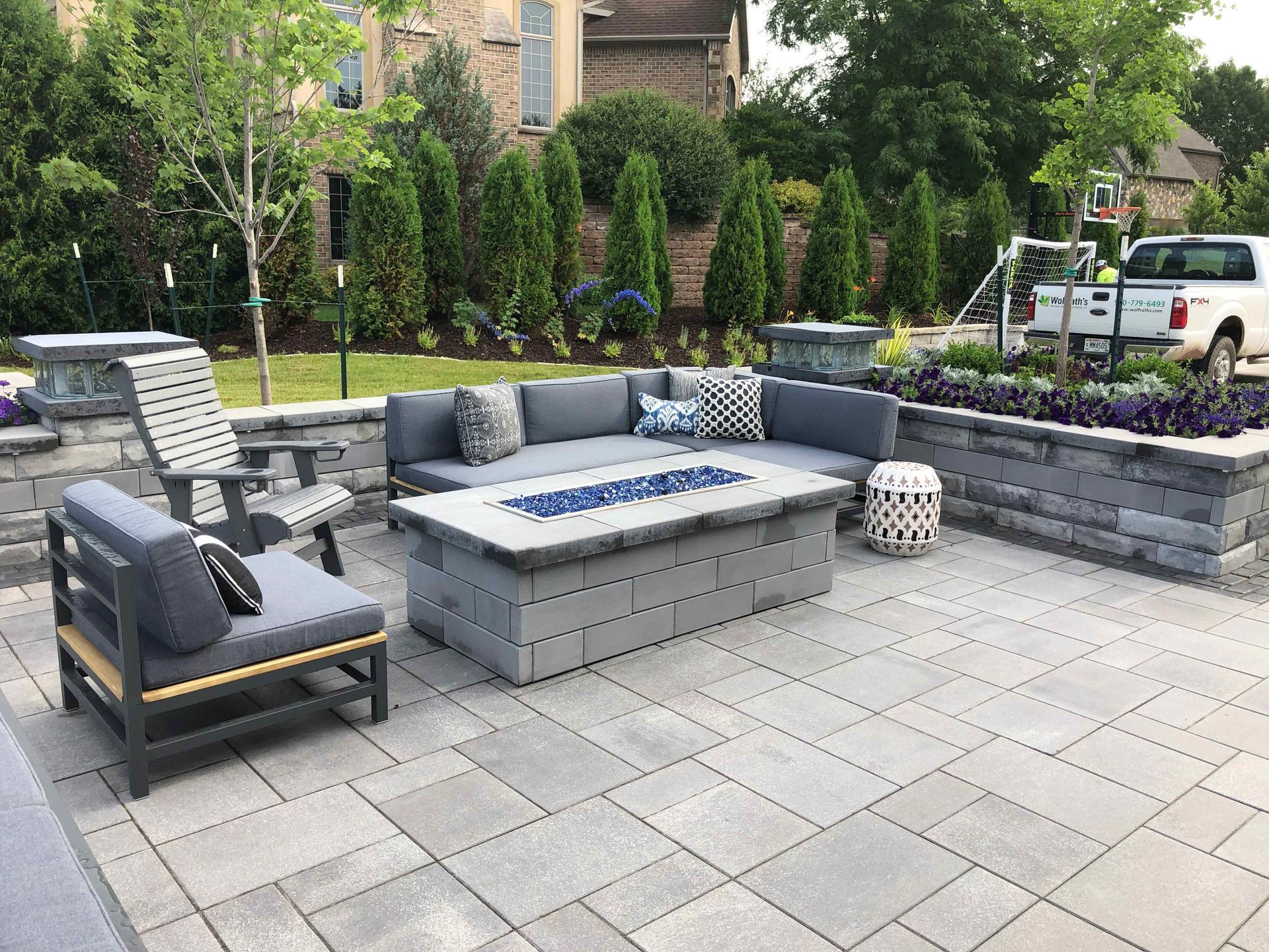 There is a fire pit in the middle of the patio.