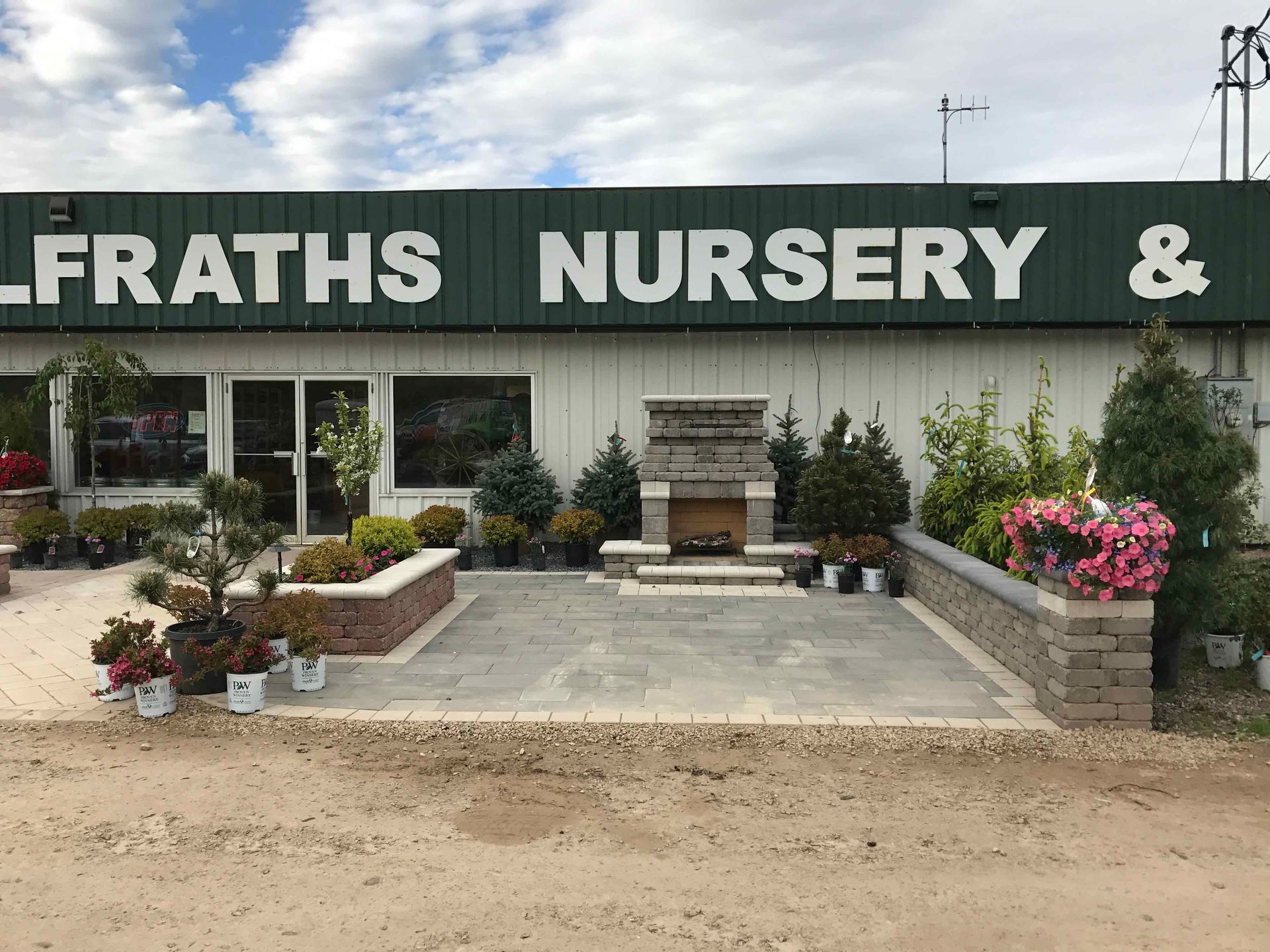 The front of a nursery with a fireplace in front of it