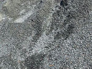 A close up of a pile of gravel on the ground.