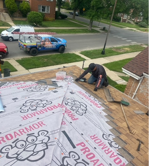 a man is working on the roof of a house using proarmor