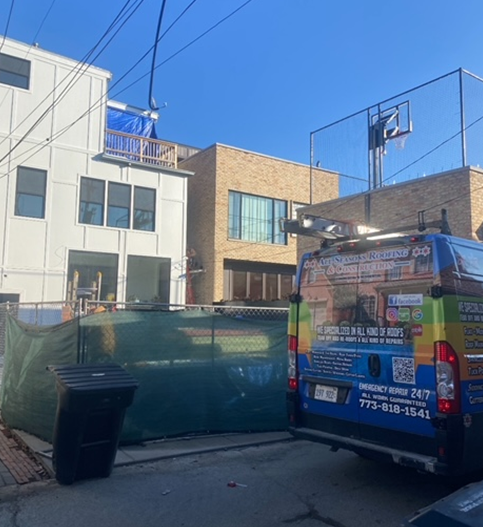 a rainbow colored van is parked in front of a building