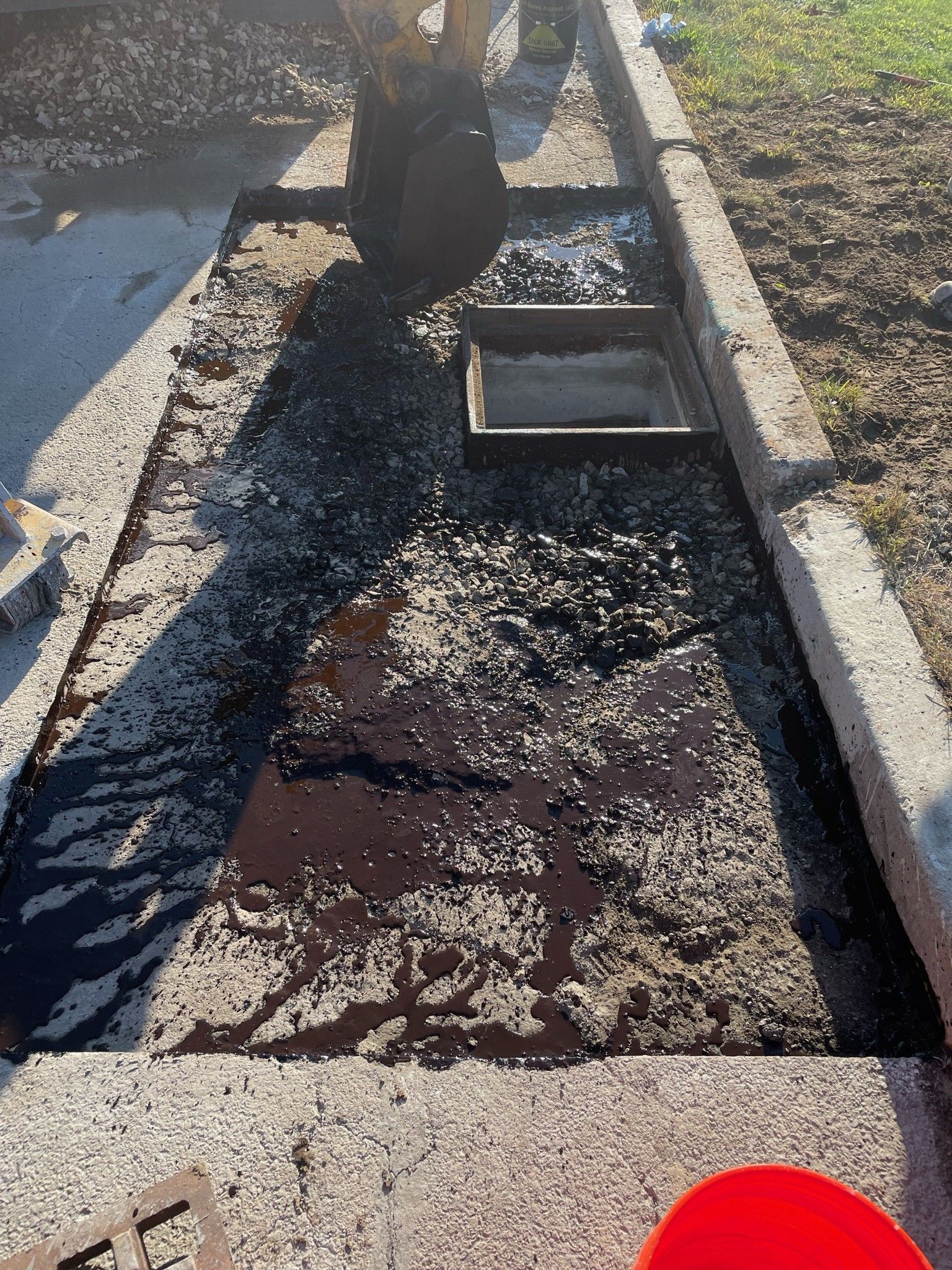 A person is digging a hole in the ground with a shovel.