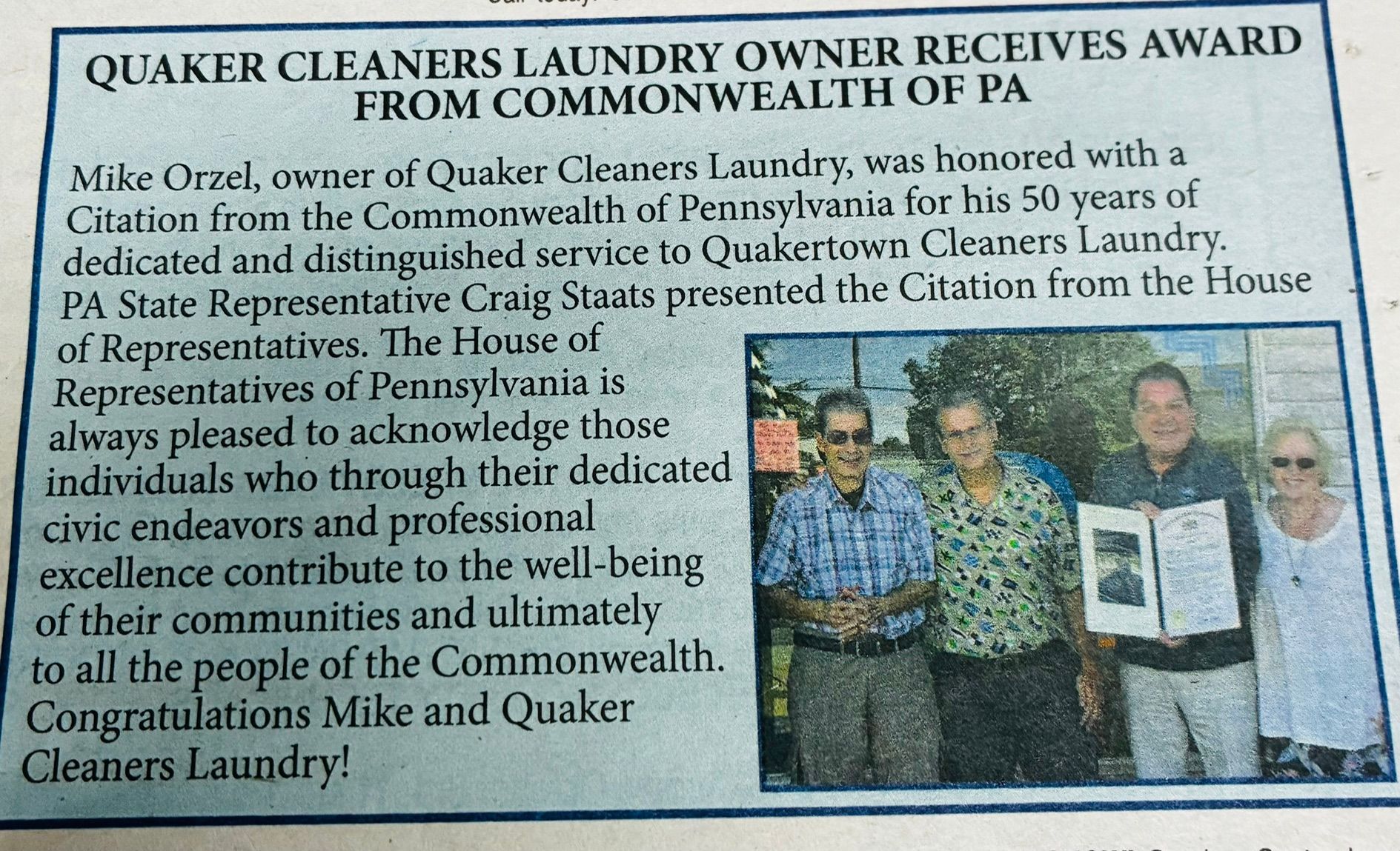 Quaker Cleaners Laundry owners receive Commonwealth of PA citation and award, posing with officials and plaque