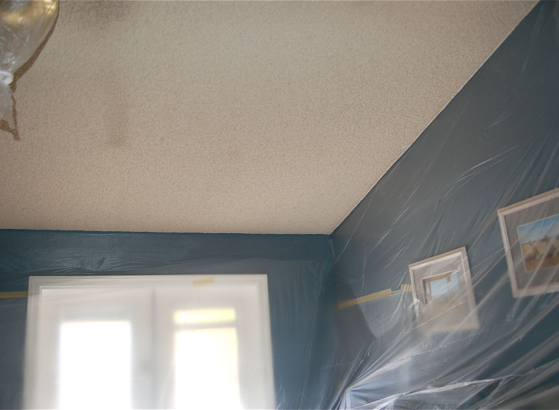 A room with a ceiling that is covered in plastic.