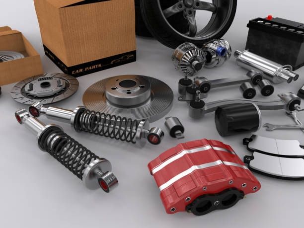 Car parts displayed, including brake rotor, shock absorbers, and battery.
