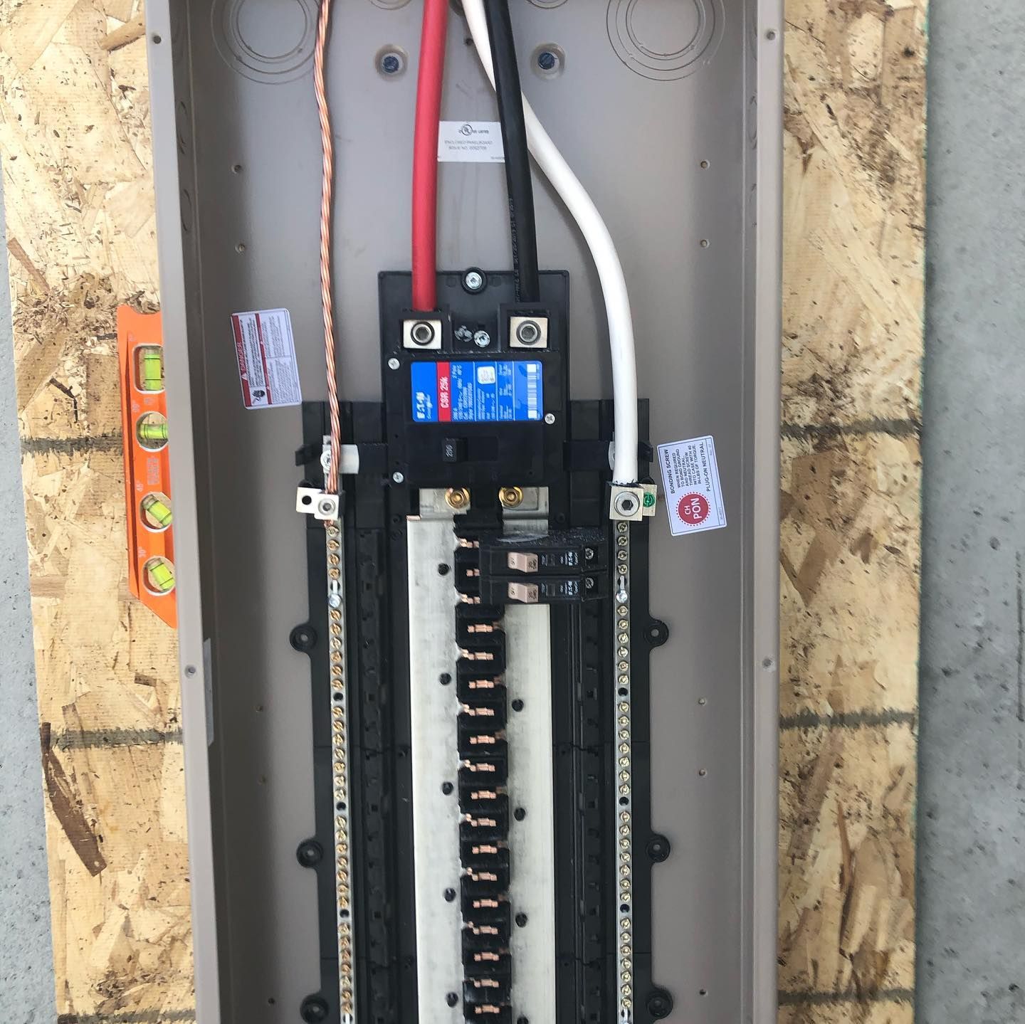 A electrical box with a blue label that says ' fuse box ' on it