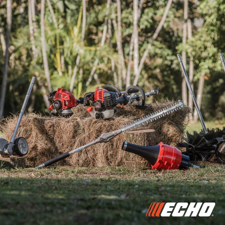 A bunch of echo tools are sitting on top of a pile of hay.