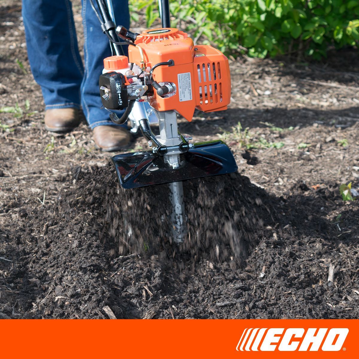A person is using a echo brand lawn mower to dig a hole in the ground