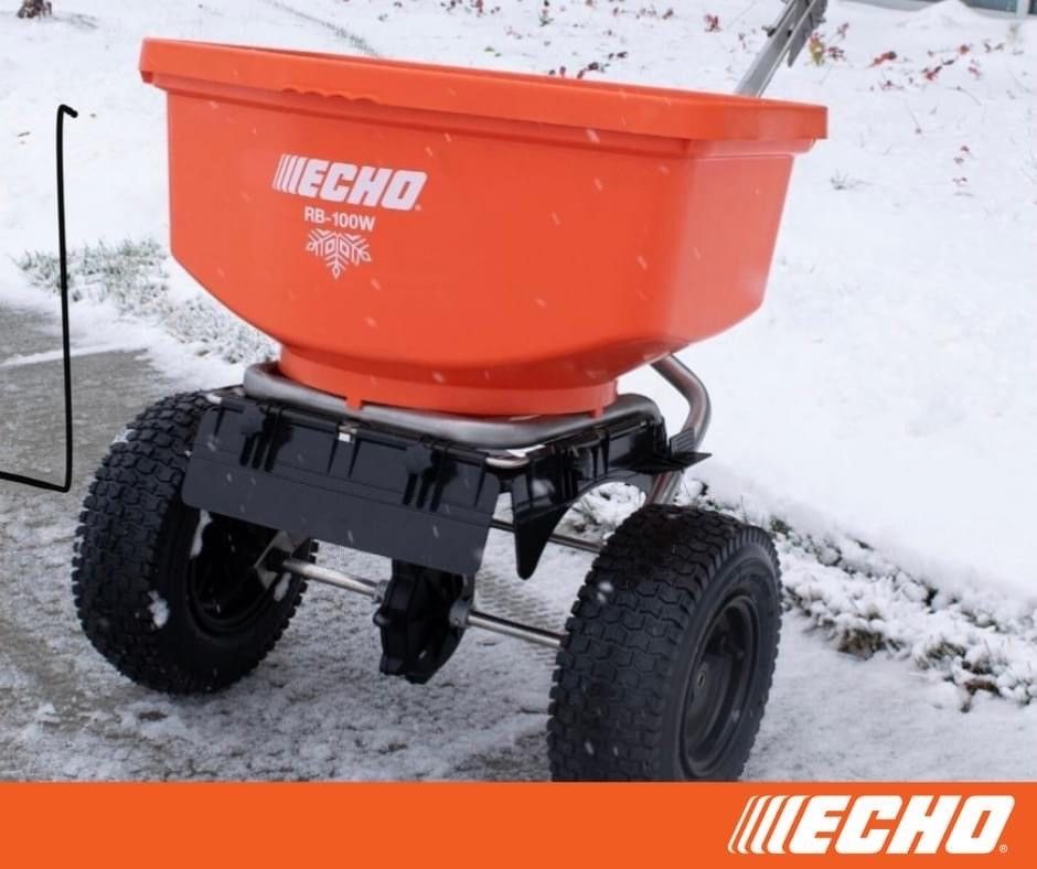 An echo spreader is sitting in the snow
