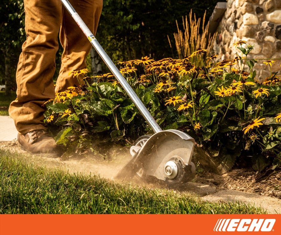 A person is using a echo lawn mower to cut the grass.